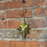 Carved Burst Gold Metal Star Orn 6.25”