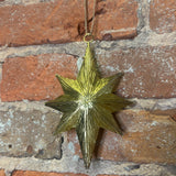 Carved Burst Gold Metal Star Orn 6.25”