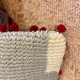 Natural & Red Tufted Snuggle Season Lumbar Pillow w/ Pom Pom Trim 28”