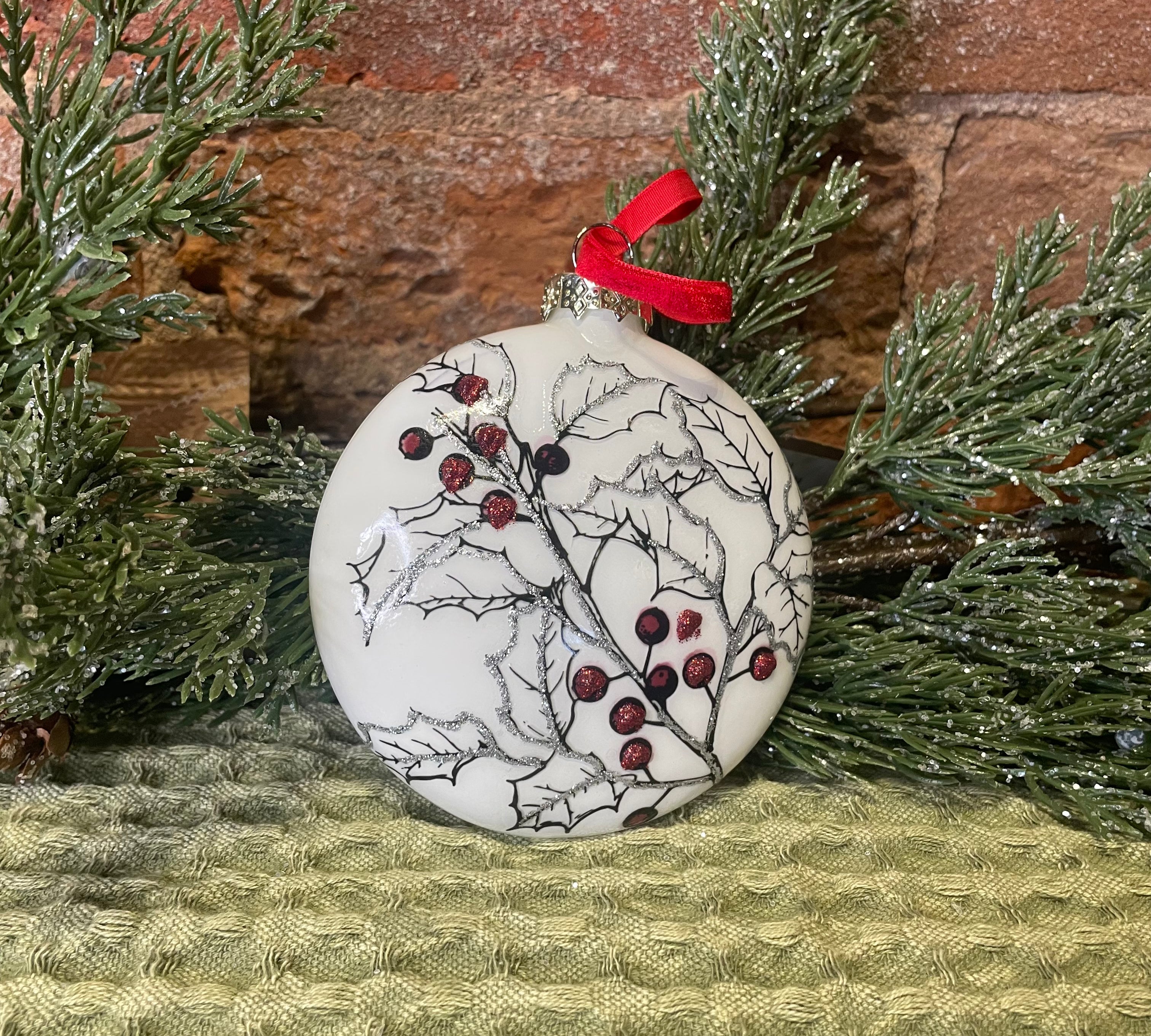 White Pine/Holly Glass Disc Orn w/ Red Ribbon 4.5"